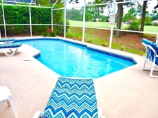 The screened pool has plenty of patio seating