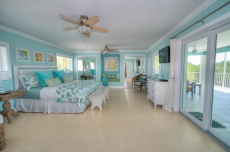 Stunning Three Level House on Main Key Largo Canal with a pool and roof deck.