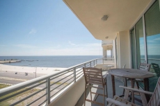 Beach Condo w/ Wrap Around Balcony, WiFi, Resort Pool & Gym Access