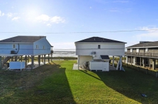 Bermuda Bungalow is a desirable 2nd row beach home steps from the sand!