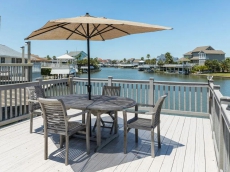 Quiet Neighborhood Retreat 4BR w/ Private Dock & Spacious Canal-View Deck