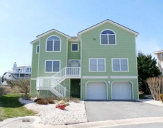 Four bedroom home with bay views from the deck in the popular Cape Shores community!