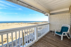 Spacious, traditional 3 bedroom oceanfront townhouse with WiFi, a large covered deck, balcony access from multiple rooms, and amazing view of ocean located uptown in family-friendly neighborhood and mere steps to beach!