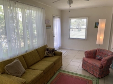 Florida room with convertable couch.